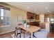 Cozy dining area with a natural light and modern furniture at 15265 W Baker Ave, Lakewood, CO 80228
