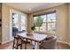 Cozy dining area with a natural light, stylish furniture, and outdoor view at 15265 W Baker Ave, Lakewood, CO 80228