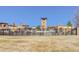 Gated community featuring stone houses, landscaping and a community pool at 15265 W Baker Ave, Lakewood, CO 80228