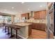 Spacious kitchen with granite countertops, stainless steel appliances, and a large island at 15265 W Baker Ave, Lakewood, CO 80228