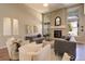 Bright and airy living room featuring a fireplace and comfortable seating at 15265 W Baker Ave, Lakewood, CO 80228