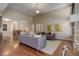 Bright and airy living room featuring hardwood floors, high ceilings, and lots of natural light at 15265 W Baker Ave, Lakewood, CO 80228