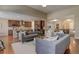 Open floor plan with a spacious living room flowing into the kitchen, great for entertaining at 15265 W Baker Ave, Lakewood, CO 80228