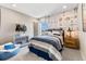 Adorable bedroom with airplane wallpaper and comfortable, modern furnishings at 23782 E 33Rd Pl, Aurora, CO 80019