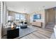 Stylish living room with modern furnishings, hardwood floors, and access to the home's staircase at 23782 E 33Rd Pl, Aurora, CO 80019