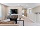 View of loft area featuring neutral walls, modern entertainment center, and plush carpeting at 23782 E 33Rd Pl, Aurora, CO 80019