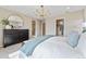 Ensuite main bedroom with walk-in closet, spa-like bathroom, and neutral decor at 23782 E 33Rd Pl, Aurora, CO 80019