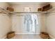 Organized walk-in closet with ample shelving and hanging space at 23782 E 33Rd Pl, Aurora, CO 80019