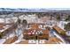 Winter aerial view showcasing a well-maintained apartment complex in a community with snow-capped mountain views at 3305 S Ammons St # 202, Lakewood, CO 80227