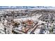 Winter aerial view of an apartment complex offering community living with snow-dusted surroundings and mountain vistas at 3305 S Ammons St # 202, Lakewood, CO 80227