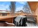 Private balcony with wicker furniture, gas grill, and views of the community at 3305 S Ammons St # 202, Lakewood, CO 80227