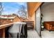 Private balcony with wicker furniture and gas grill, offering views of community at 3305 S Ammons St # 202, Lakewood, CO 80227