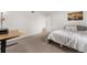 Spacious bedroom with a bed and home office at 3305 S Ammons St # 202, Lakewood, CO 80227