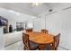 Small dining area with wood table and chairs near kitchen and living room at 3305 S Ammons St # 202, Lakewood, CO 80227