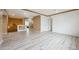 Large bonus room with wood-look flooring, neutral color palette, and recessed lighting at 5293 Malaya St, Denver, CO 80249