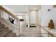 A foyer entryway with staircase leading to a spacious living room at 5293 Malaya St, Denver, CO 80249