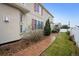 Exterior view of a home with red shutters, manicured lawn, and a stone walkway at 5293 Malaya St, Denver, CO 80249