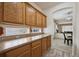 A kitchen featuring lots of cabinet space and an archway through to the living area at 5293 Malaya St, Denver, CO 80249