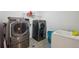 Bright laundry room featuring a front-load washer and dryer at 5293 Malaya St, Denver, CO 80249