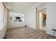 Empty living room featuring wood flooring, an open layout and abundant natural light at 5293 Malaya St, Denver, CO 80249