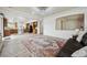 Open living room with modern wood floors, smooth access to kitchen and natural light at 5293 Malaya St, Denver, CO 80249
