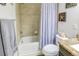 Bathroom with a bathtub, shower, and decorative accents at 8321 E 33Rd Ave, Denver, CO 80238