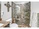 This bathroom has a luxurious tile shower with a built-in bench at 8321 E 33Rd Ave, Denver, CO 80238