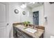 Bathroom featuring dual sinks and a large mirror at 8321 E 33Rd Ave, Denver, CO 80238