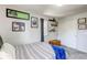 Bedroom with blue blanket and decorations at 8321 E 33Rd Ave, Denver, CO 80238