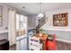 Cozy dining area with access to the outdoor patio and a staircase visible at 8321 E 33Rd Ave, Denver, CO 80238