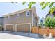 Two-story home with a two-car garage and a fenced yard at 8321 E 33Rd Ave, Denver, CO 80238