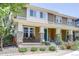 Lovely exterior featuring a covered porch with brick accents and manicured landscaping at 8321 E 33Rd Ave, Denver, CO 80238