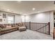 Upstairs living area with comfortable seating and plenty of natural light from the windows at 8321 E 33Rd Ave, Denver, CO 80238