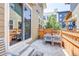 Private outdoor patio perfect for dining or relaxing, with a view of the surrounding community at 8321 E 33Rd Ave, Denver, CO 80238