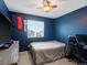 Cozy bedroom with a window, desk, and ceiling fan, perfect for a or teen at 4436 Windmill Dr, Brighton, CO 80601