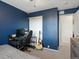 Cozy bedroom with a desk and door to another room, ideal for a relaxing or gaming space at 4436 Windmill Dr, Brighton, CO 80601