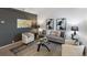 Cozy living room featuring stylish decor, modern furniture, and a chic area rug for comfort at 4436 Windmill Dr, Brighton, CO 80601