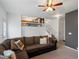 Spacious living room showing staircase and railing to the second floor at 4436 Windmill Dr, Brighton, CO 80601
