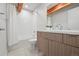 Bathroom with tiled shower, wood accents, modern vanity, and recessed lighting for a clean and modern design at 1711 Hooker St # 2, Denver, CO 80204