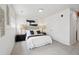 Serene bedroom with plush carpeting, accent lamps and a stylish upholstered headboard, offering a tranquil retreat at 1711 Hooker St # 2, Denver, CO 80204