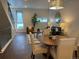 Open-concept living room with modern decor, wood floors, staircase and big windows create an airy and bright atmosphere at 1711 Hooker St # 2, Denver, CO 80204