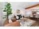 Open-concept living area featuring dining and living spaces with hardwood floors and modern decor at 1711 Hooker St # 2, Denver, CO 80204