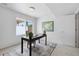 Bright office space with a black desk, woven chair, contemporary art, and natural light promoting productivity at 1711 Hooker St # 2, Denver, CO 80204