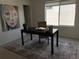 Bright office space with a dark table, rug, and artwork, perfect for remote work or study at 1711 Hooker St # 2, Denver, CO 80204