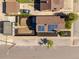 An aerial view showing the house with solar panels, a well-kept yard, and a detached garage at 3105 N Elizabeth St, Denver, CO 80205