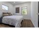 Cozy bedroom features natural light and wood-look flooring, creating a warm and inviting space at 3105 N Elizabeth St, Denver, CO 80205