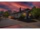 Exterior view of home during twilight, highlighting the front yard with new landscaping and charm at 3105 N Elizabeth St, Denver, CO 80205