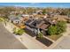 Aerial shot of a charming gray house with solar panels on the roof and a landscaped front yard at 3105 N Elizabeth St, Denver, CO 80205
