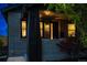 Charming front porch with brick accents and well-lit windows, creating a warm and inviting entrance at 3105 N Elizabeth St, Denver, CO 80205