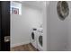Clean laundry room with modern washer and dryer units at 3105 N Elizabeth St, Denver, CO 80205
